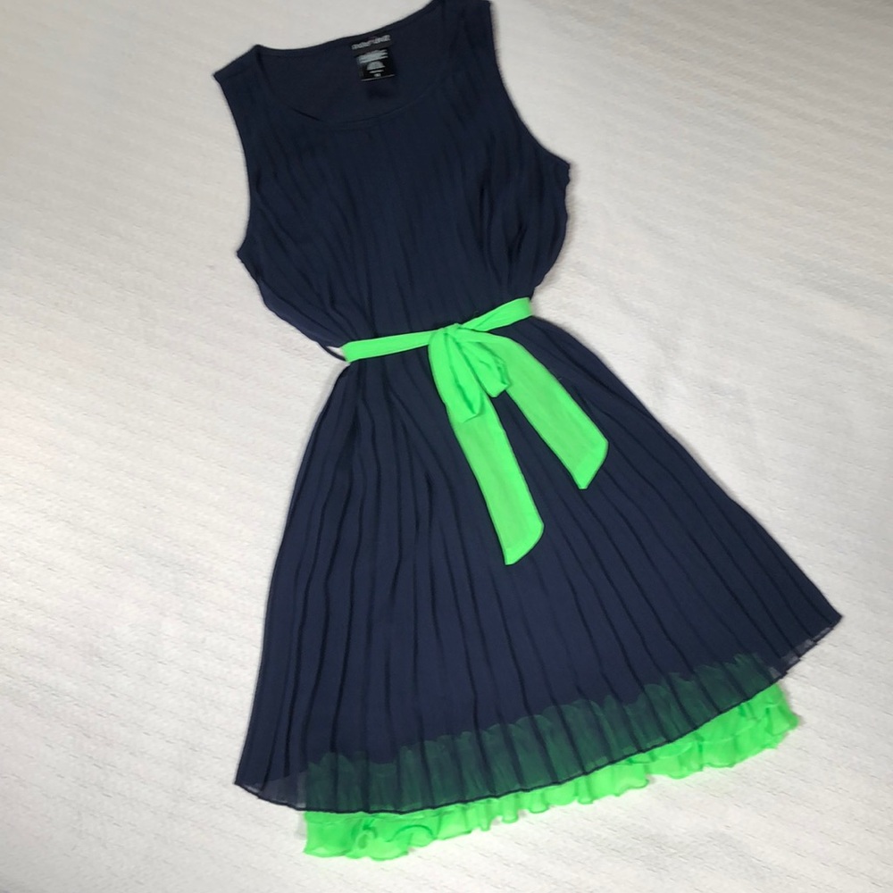 Navy blue pleated dress with bright green accents
